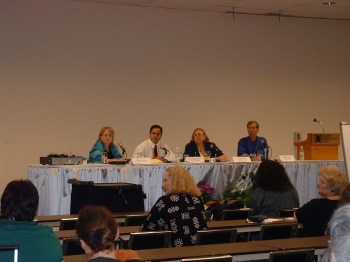 Ray Hemachandra hosting a retailing panel in Denver, Colorado, at the International New Age Trade Show, with business owners Candace Apple, Jean Haller, and David Cronin.