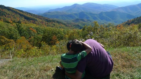 Ray and Nicholas Hemachandra sitting by the Blue Ridge Parkway in North Carolina (photo by Kristi Pfeiffer)