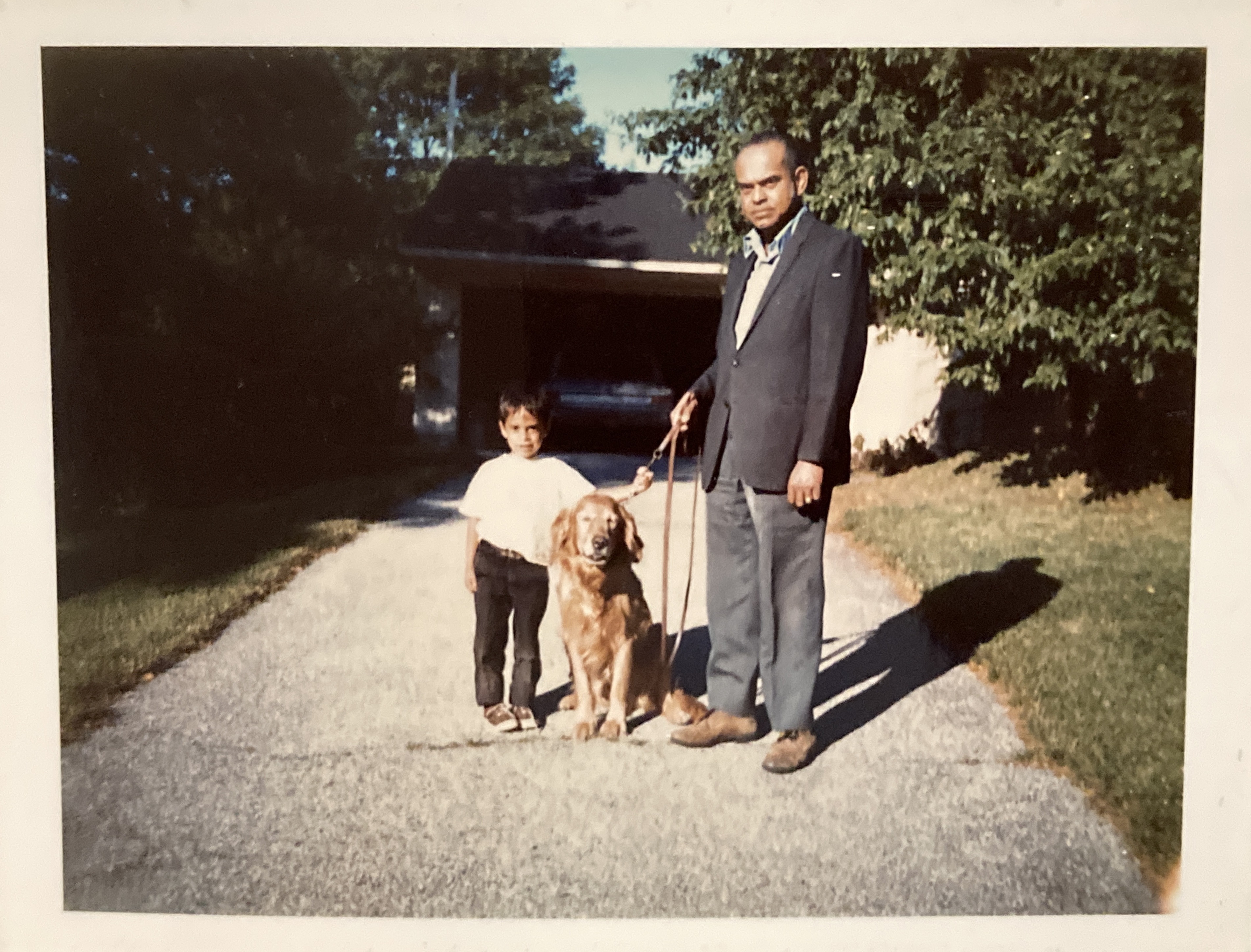 Ray Hemachandra and Neal Hemachandra at our house on Long Island with our dog, Butterscotch